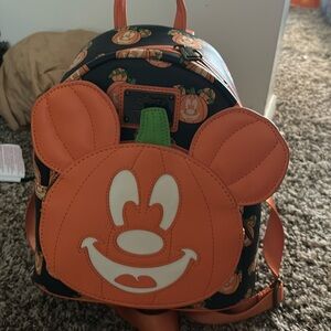 Pumpkin Mickey Halloween loungefly.   Used maybe 3 times.  Glows in the dark.